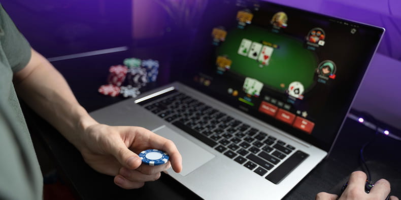 Man Gambling Online on His Portable Computer